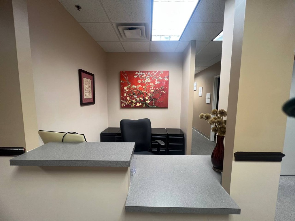 Therapy office reception area with calm artwork